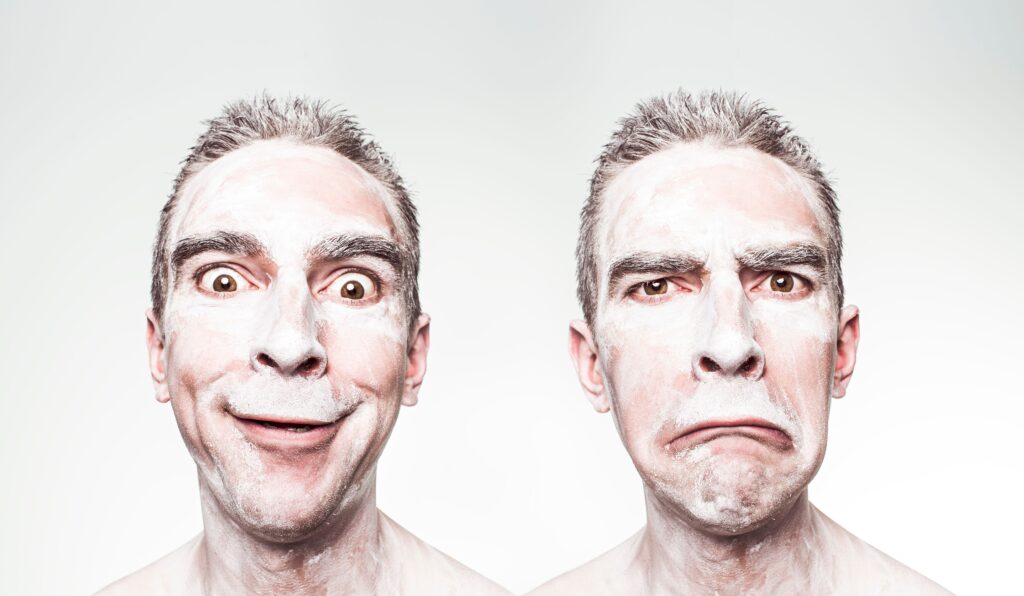 A whimsical portrait showing dual expressions of a man with a painted face.